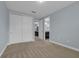 Bright bedroom featuring plush carpet and ample closet space at 10747 Belfry Cir, Orlando, FL 32832
