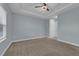 Spacious bedroom with neutral walls and carpeted floor at 10747 Belfry Cir, Orlando, FL 32832