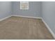 Simple bedroom with neutral walls and carpeted floor at 10747 Belfry Cir, Orlando, FL 32832