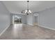 Open dining room with tile floors and a chandelier at 10747 Belfry Cir, Orlando, FL 32832