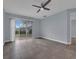 Spacious Gathering room with tile floors and sliding glass doors to backyard at 10747 Belfry Cir, Orlando, FL 32832