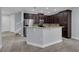 Island kitchen with granite counters and stainless steel appliances at 10747 Belfry Cir, Orlando, FL 32832