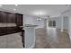 Kitchen features dark cabinets, granite counters, and stainless steel appliances at 10747 Belfry Cir, Orlando, FL 32832