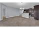 Modern kitchen with dark cabinetry, stainless steel appliances, and breakfast bar at 10747 Belfry Cir, Orlando, FL 32832