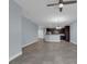 Open concept living room with tile floors and kitchen view at 10747 Belfry Cir, Orlando, FL 32832