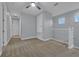 Loft area with carpet, ceiling fan and access to upstairs hallway at 10747 Belfry Cir, Orlando, FL 32832
