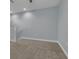 Spacious loft area with neutral colored carpet and walls at 10747 Belfry Cir, Orlando, FL 32832