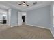 Main bedroom with access to bathroom and walk-in closet at 10747 Belfry Cir, Orlando, FL 32832