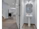 Small powder room with pedestal sink and mirror at 10747 Belfry Cir, Orlando, FL 32832
