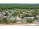 Aerial view of the neighborhood showcasing lush greenery, community layout and proximity to nature at 1121 Trotwood Blvd, Winter Springs, FL 32708