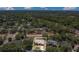Aerial view of the property, nestled in a lush neighborhood with mature trees and private backyard at 1121 Trotwood Blvd, Winter Springs, FL 32708