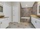 Bathroom showcasing a walk-in shower, double sink vanity, and stylish tile flooring at 1121 Trotwood Blvd, Winter Springs, FL 32708