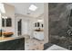 Bathroom featuring a modern vanity, stylish shower, and a sleek, updated design at 1121 Trotwood Blvd, Winter Springs, FL 32708