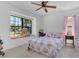 Cozy bedroom featuring a large window seat and bright floral accents at 1121 Trotwood Blvd, Winter Springs, FL 32708