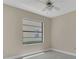 Bright bedroom with a large window at 1121 Trotwood Blvd, Winter Springs, FL 32708