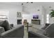 Open-concept living room with a fireplace, tile flooring, and ample space for seating and entertainment at 1121 Trotwood Blvd, Winter Springs, FL 32708