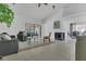 Bright living room featuring tile floors, a fireplace, and sliding glass doors leading to an outdoor space at 1121 Trotwood Blvd, Winter Springs, FL 32708