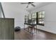 Home office space with hardwood floors, natural light, and modern desk setup at 1121 Trotwood Blvd, Winter Springs, FL 32708