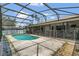 Inviting in-ground pool with a screened enclosure, perfect for outdoor relaxation and entertaining at 1121 Trotwood Blvd, Winter Springs, FL 32708