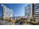 Outdoor plaza with palm trees, restaurants, shopping, and entertainment venues that create a vibrant space at 155 S Court Ave # 1610, Orlando, FL 32801