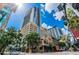 Stunning view of the building with modern architecture against a backdrop of blue skies at 155 S Court Ave # 1610, Orlando, FL 32801