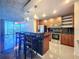 Modern kitchen featuring a breakfast bar with seating, stainless steel appliances and ample cabinet space at 155 S Court Ave # 1610, Orlando, FL 32801
