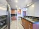 Modern kitchen showcasing stainless steel appliances, granite countertops, tile backsplash, and designer lighting at 155 S Court Ave # 1610, Orlando, FL 32801