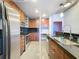 Kitchen with stainless steel appliances, granite countertops, tile backsplash, and modern fixtures at 155 S Court Ave # 1610, Orlando, FL 32801