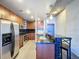 Modern kitchen featuring a breakfast bar with seating, stainless steel appliances and ample cabinet space at 155 S Court Ave # 1610, Orlando, FL 32801