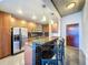 Modern kitchen featuring a breakfast bar with seating, stainless steel appliances and ample cabinet space at 155 S Court Ave # 1610, Orlando, FL 32801