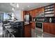 Stylish kitchen features dark backsplash, stainless steel appliances, and a breakfast bar at 155 S Court Ave # 1610, Orlando, FL 32801