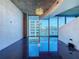 Living room with expansive glass windows offering abundant natural light and city views at 155 S Court Ave # 1610, Orlando, FL 32801