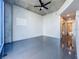 Modern bedroom with tile floors, ceiling fan, and ensuite bathroom at 155 S Court Ave # 1610, Orlando, FL 32801