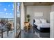 Modern bedroom with floor to ceiling windows and a cityscape view at 155 S Court Ave # 1610, Orlando, FL 32801
