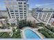A refreshing swimming pool surrounded by lush landscaping and lounge chairs at 155 S Court Ave # 1610, Orlando, FL 32801
