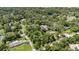 Beautiful aerial shot displaying a tranquil neighborhood setting with lush greenery at 5100 Linwood Cir, Sanford, FL 32771