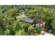 Home nestled in a lush landscape, offering privacy and serene surroundings at 5100 Linwood Cir, Sanford, FL 32771