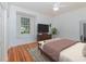 Bedroom featuring hardwood floors, a ceiling fan, natural light and a built-in window seat at 5100 Linwood Cir, Sanford, FL 32771