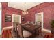 Elegant dining room with dark wood floors, chandelier, and views to other rooms at 5100 Linwood Cir, Sanford, FL 32771