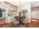 Cozy dining room with hardwood floors and built in shelving at 5100 Linwood Cir, Sanford, FL 32771
