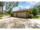 Detached two-car garage with an asphalt driveway at 5100 Linwood Cir, Sanford, FL 32771
