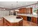 Expansive kitchen featuring custom cabinets, large center island, and modern appliances at 5100 Linwood Cir, Sanford, FL 32771