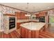 Gourmet kitchen features stainless steel appliances, granite countertops, an island, and brick oven at 5100 Linwood Cir, Sanford, FL 32771