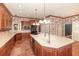 Gourmet kitchen showcases custom cabinets, a large center island with breakfast bar, and modern appliances at 5100 Linwood Cir, Sanford, FL 32771