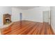 Spacious living room featuring a decorative fireplace and well-maintained hardwood flooring at 5100 Linwood Cir, Sanford, FL 32771