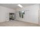 Bright living room with neutral carpet and multiple access points to other rooms at 5100 Linwood Cir, Sanford, FL 32771