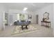 Inviting living room with neutral carpet, stylish furnishings, and ample natural light at 5100 Linwood Cir, Sanford, FL 32771