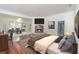 Well-staged main bedroom featuring a fireplace, hardwood floors, and sitting area at 5100 Linwood Cir, Sanford, FL 32771