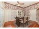 Home office with wood floors, built in shelving, a ceiling fan, and natural light at 5100 Linwood Cir, Sanford, FL 32771