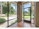 Screened porch with tile flooring, brick columns, and views of the backyard at 5100 Linwood Cir, Sanford, FL 32771